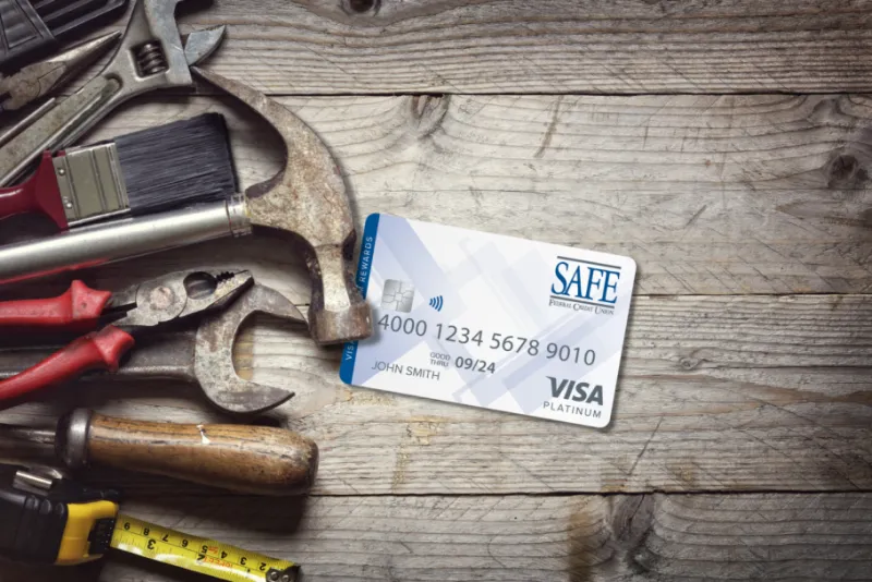 SAFE Credit Card with tools behind it