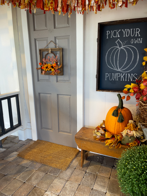 Pumpkin in the entryway of a house.