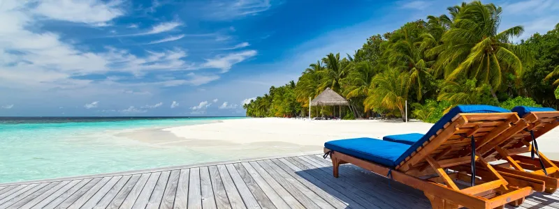 Chairs on dock overlooking beach