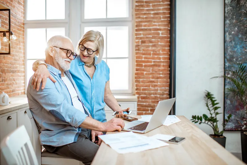 Man and Wife Enjoying Interest Rebates from Local Credit Union