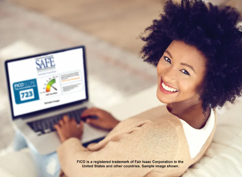 woman on a laptop checking her FICO Score