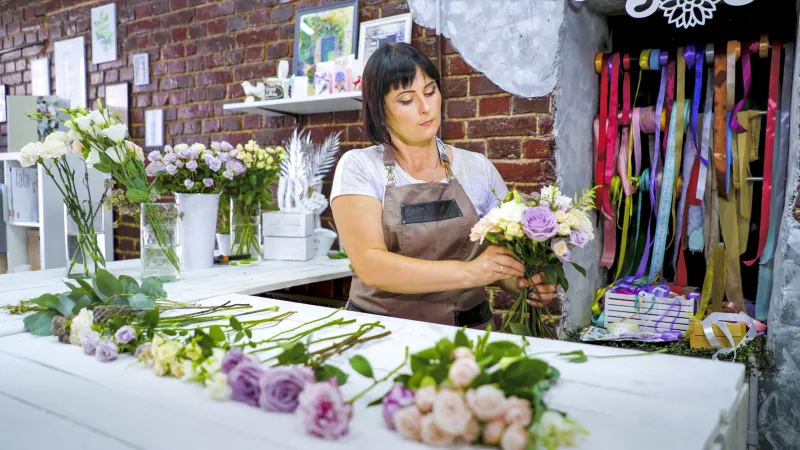 female florist arranging flowers