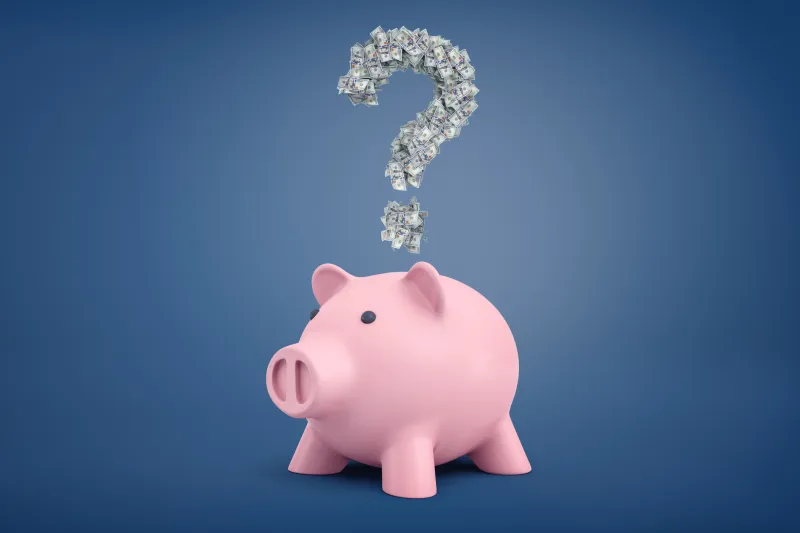 Pink piggy bank with a question mark made out of money above its head.