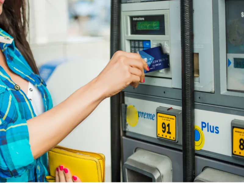 woman using card at the gas pump