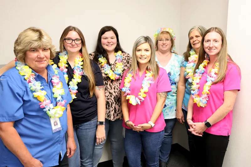 SAFE employees wearing Hawaiian Leis