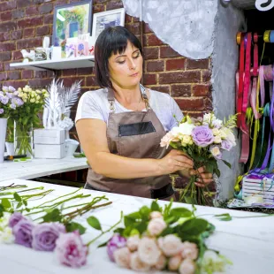 female florist arranging flowers