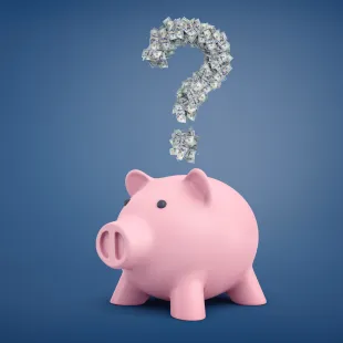 Pink piggy bank with a question mark made out of money above its head.