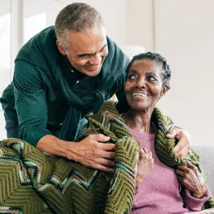 an elder patient being comforted by a loved one