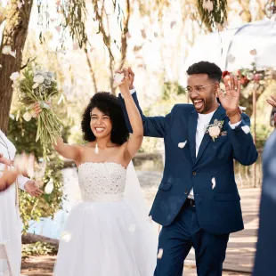 Husband and Wife celebrating on their wedding day.