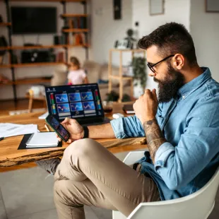 man looking at his stock investments on smart phone.