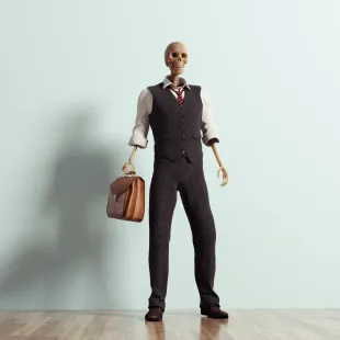 A skeleton dressed in a business suit.