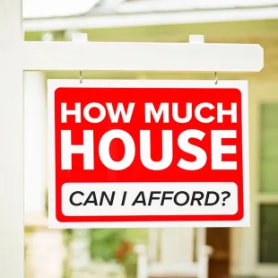red and white sign that reads "How much house can I afford?"