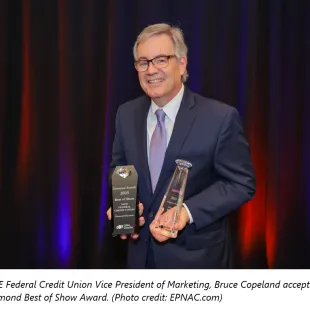 SAFE Federal Credit Union Vice President of Marketing, Bruce Copeland accepts the Diamond Best of Show Award. (Photo credit: EPNAC.com)