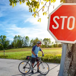 man on a bike at a stop sign