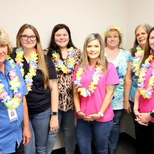 SAFE employees wearing Hawaiian Leis